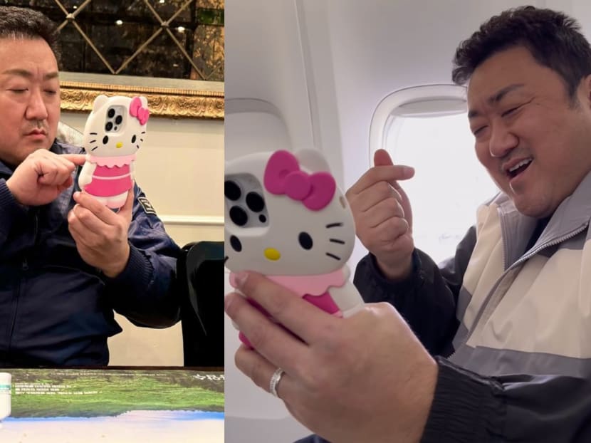 Hunky Korean star Don Lee, 52, uses a super cute Hello Kitty phone case