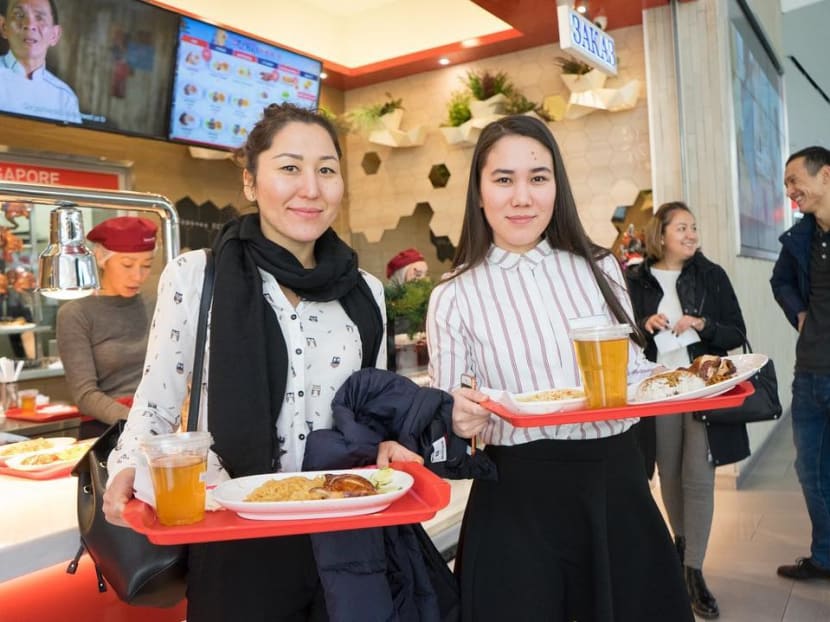 Customers at a Hawker Chan franchise outlet at Almaty, Kazakhstan's largest city, that offers the one-Michelin-starred soya sauce chicken rice and noodles by Singapore Chinatown hawker Chan Hon Meng.