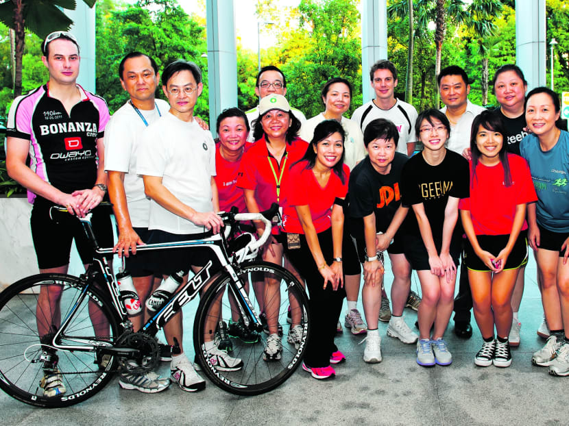 BP employees who cycle to work or participate in morning runs. The oil giant received the Best Green Transport Partner Award yesterday. Photo: BP  Singapore