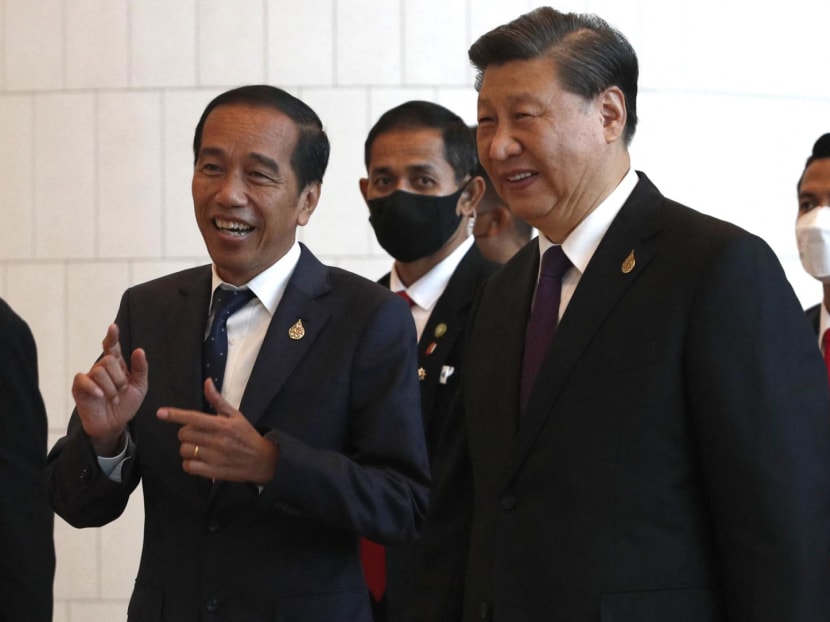 China's President Xi Jinping (right) chats with Indonesia's President Joko Widodo (left) after the 29th APEC Economic Leaders’ Meeting (AELM) during the Asia-Pacific Economic Cooperation (APEC) summit in Bangkok on Nov 18, 2022.