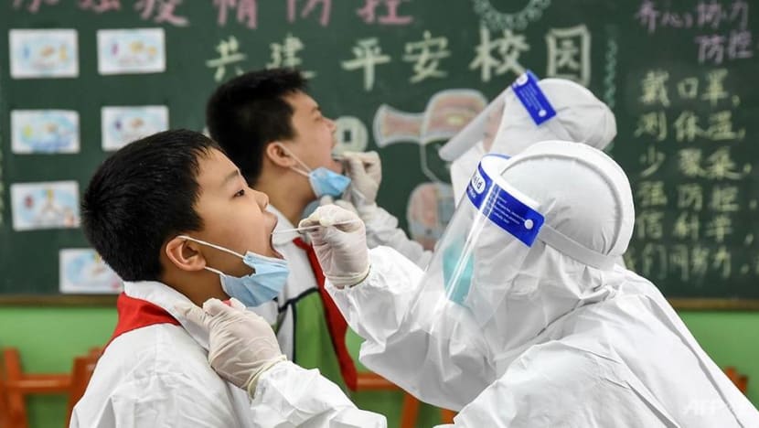 Commentary: Why China is more willing to test millions than trust vaccination