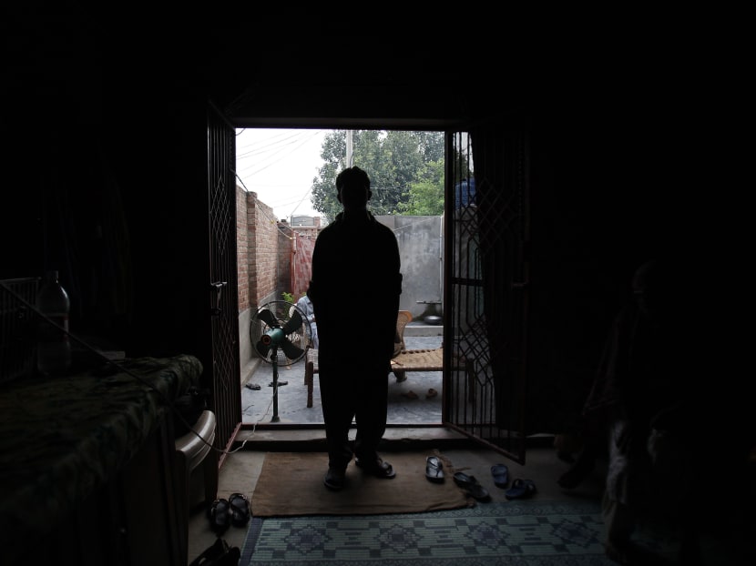 A victim of a child sex abuse scandal stands in his house in Hussain Khan Wala town, in Kasur district near Lahore, Pakistan, on Aug 10, 2015. Photo: AP