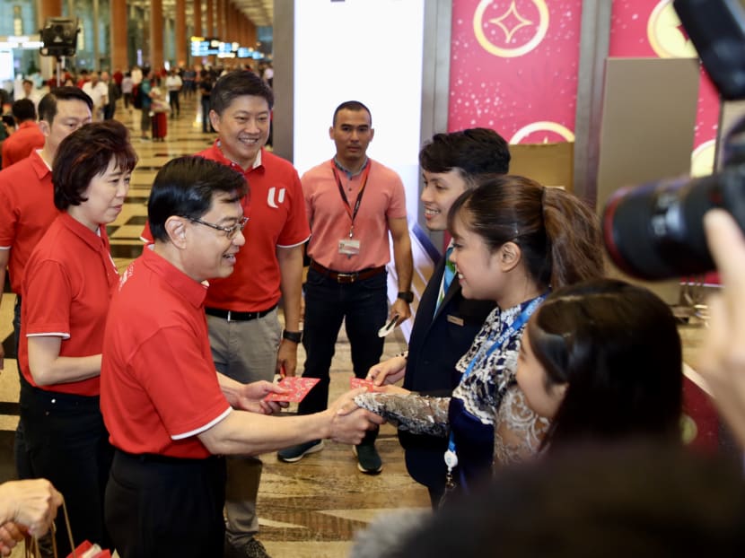 Deputy Prime Minister Heng Swee Keat, National Trades Union Congress president Mary Liew and secretary-general Ng Chee Meng, and Senior Minister of State for transport Lam Pin Min showing appreciation to ground-handling agents at Changi Airport Terminal 3.