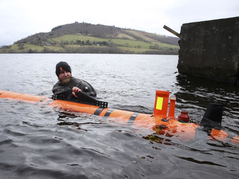 Subsea engineer John Haig launches Munin, an intelligent marine robot, to explore Loch Ness in Scotland, Britain April 13, 2016.  Photo: Reuters