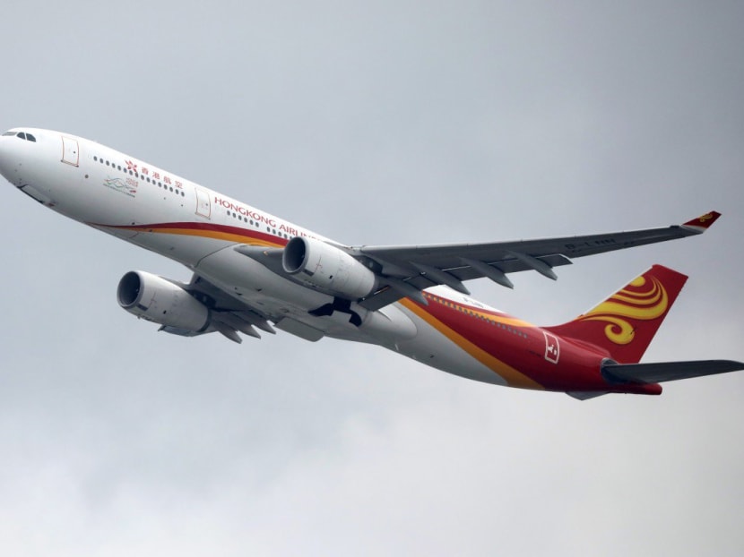 A Hong Kong Airlines plane leaves Hong Kong International Airport. A Hong Kong Airlines plane leaves Hong Kong International Airport.