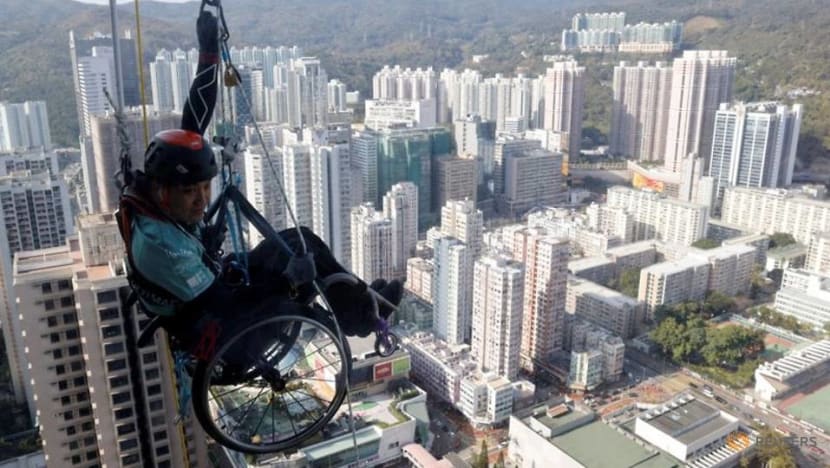 In wheelchair, paraplegic Lai Chi-wai climbs up skyscraper in Hong Kong In wheelchair, paraplegic Lai Chi-wai climbs up skyscraper in Hong Kong