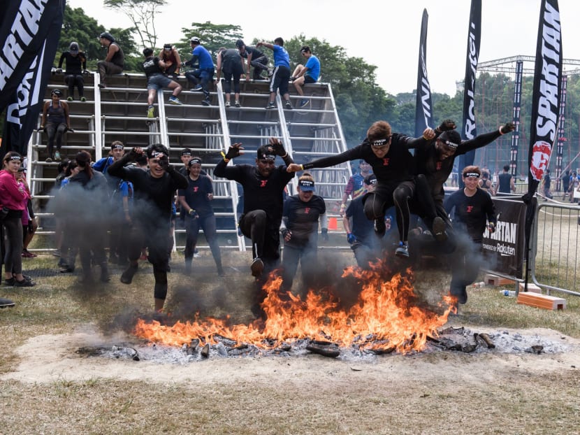 Competitors in a Spartan Race, an obstacle-course race held in various countries around the world, in 2019.