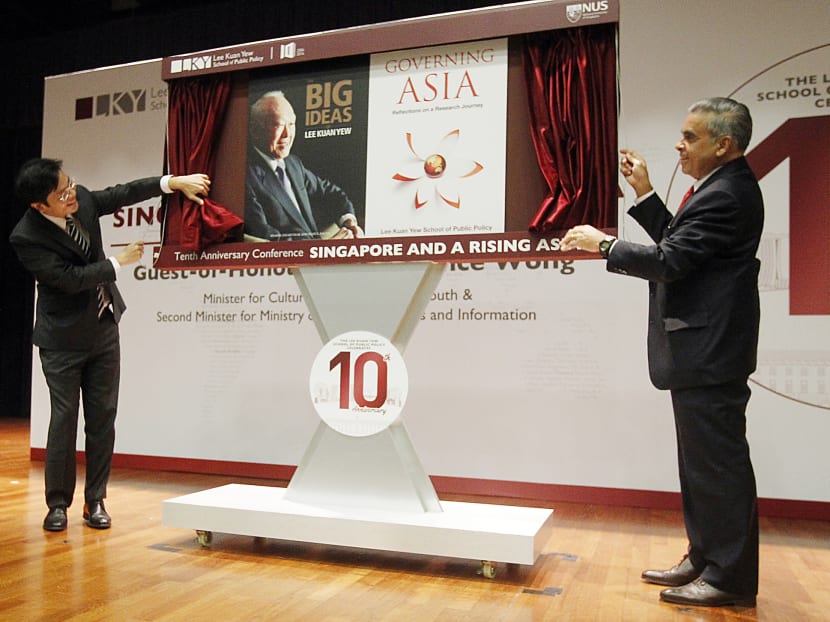 Mr Lawrence Wong and Professor Kishore Mahbubani, Dean of the Lee Kuan Yew School of Public Policy, launching the two new books on public policy  at the school’s 10th-anniversary conference yesterday. 
Photo: Ernest Chua