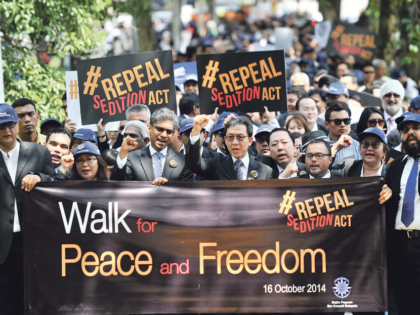 More than 500 lawyers, led by Mr Christopher Leong (middle), president of the Malaysian Bar, marching towards Parliament in Kuala Lumpur yesterday. Photo: The Malay Mail