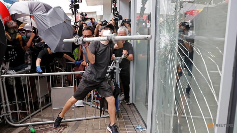 Protesters try to smash way into Hong Kong Legislative Council Protesters try to smash way into Hong Kong Legislative Council
