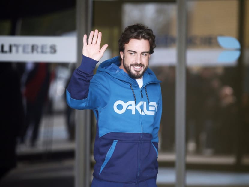 Fernando Alonso leaving the hospital, where he had been confined since his crash, on Feb 25. Briatore rubbished reports that Alonso had forgotten the past 20 years of his life after the accident. Photo: Reuters