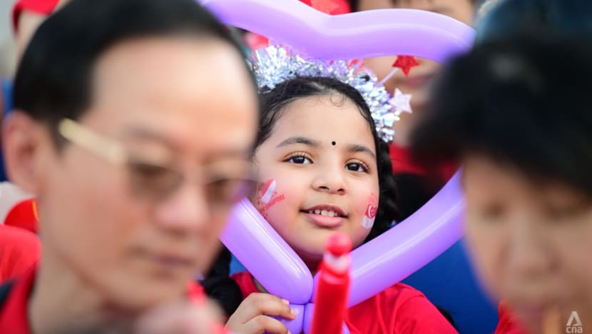little girl with balloon at national day parade 2023