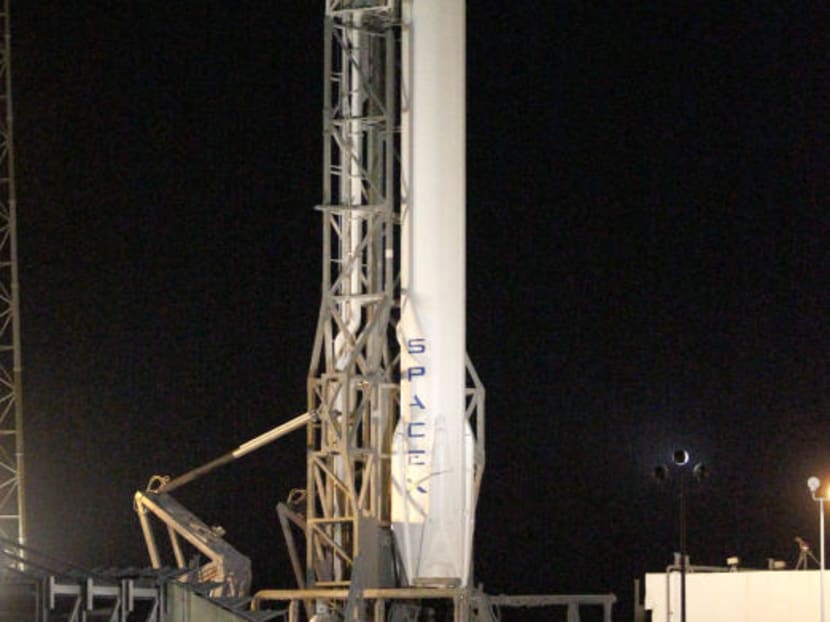 A Falcon 9 rocket carrying the SpaceX Dragon spacecraft stands ready for launch from complex 40 at the Cape Canaveral Air Force Station in Cape Canaveral on Jan 5, 2015. Photo: AP