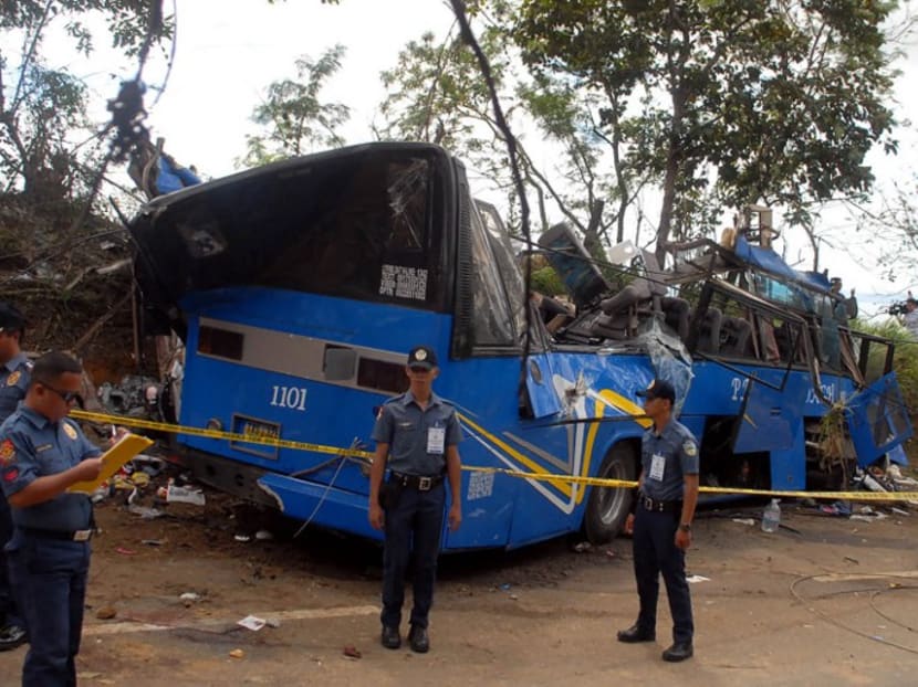 Police officers at the crash site. Photo: AFP