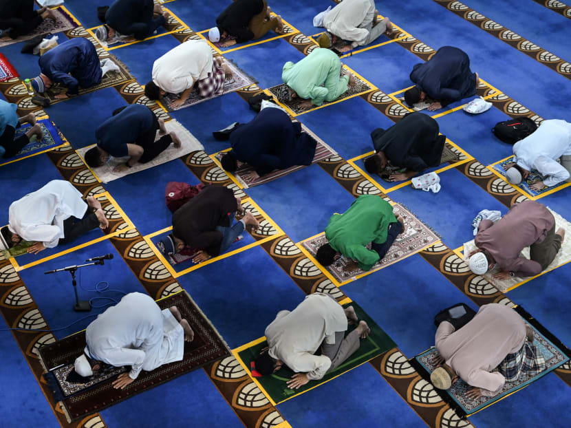 Congregants observe social distancing while attending the Friday prayers at Al-Istighfar Mosque in Singapore on June 26, 2020.