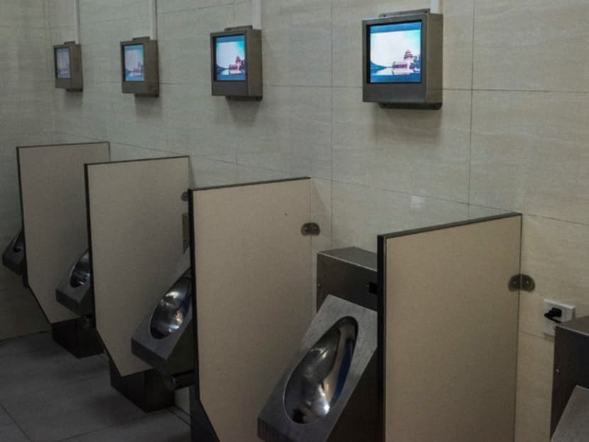 A state-of-the-art public toilet equipped with Wi-Fi, an ATM, chargers for mobile phones and electric vehicles, and personal television screens in China.