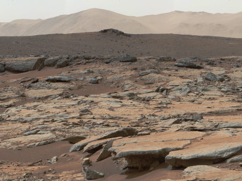 A team of the School of Physics and Astronomy at the University of Edinburgh discovered that the red planet would be "less liveable" than expected due to the creation of a "toxic cocktail" on its surface under the effect of ultraviolet radiation. Photo: NASA via AFP
