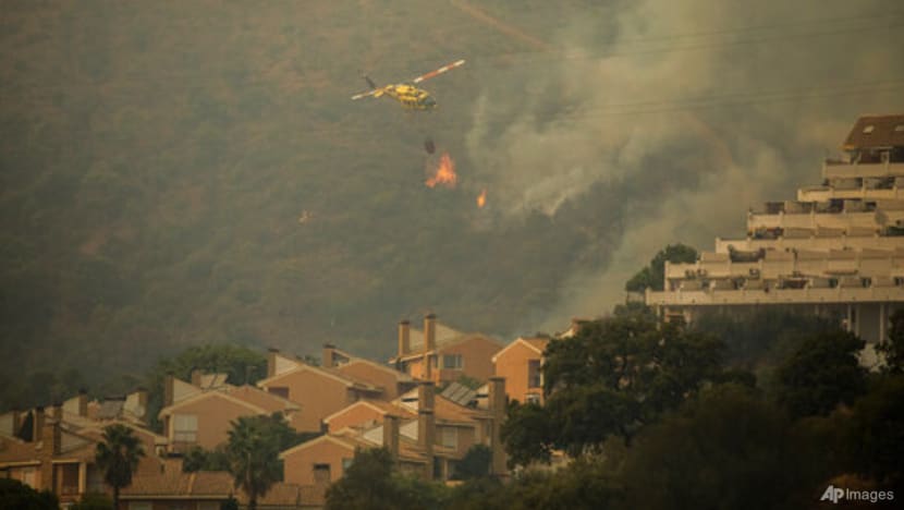 Strong wind complicates fighting wildfire in southeast Spain