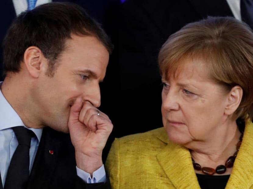 File photo of French President Emmanuel Macron and German Chancellor Angela Merkel. REUTERS