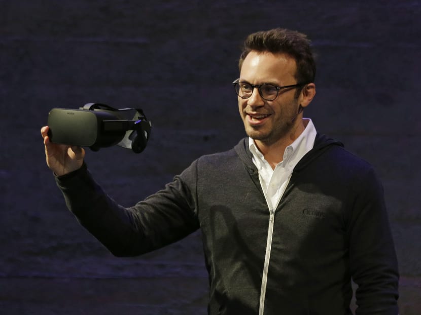 In this June 11, 2015 file photo, Oculus CEO Brendan Iribe holds up the new Rift virtual reality headset during a news conference in San Francisco. Photo: AP