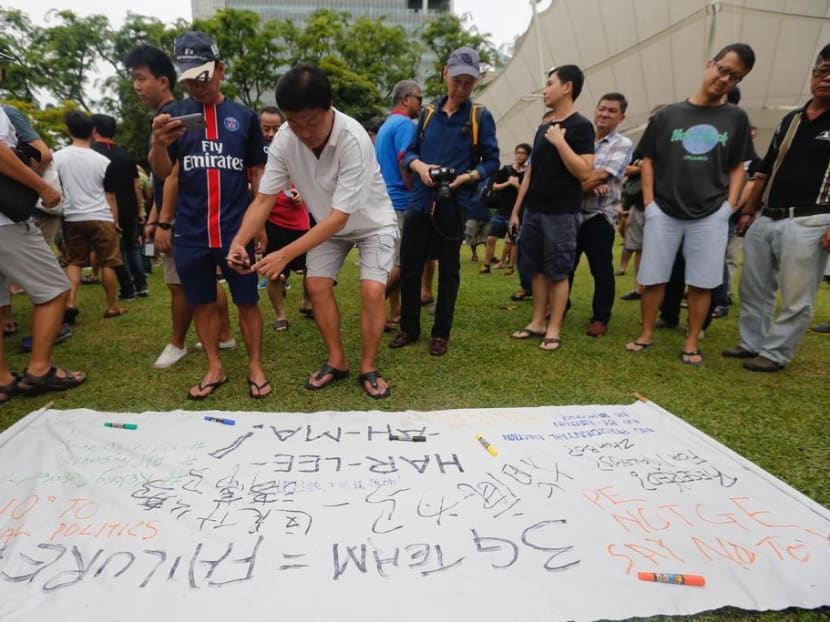 The prosecution is seeking the maximum S$5,000 fine for Ho Hee Hew, 59, who admitted he left a toy grenade near Hong Lim Park in September 2017 to try to force a group of protesters (pictured) to leave the area.
