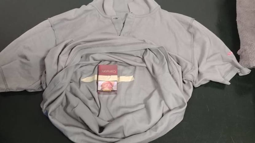 Man fined S$1,800 for trying to smuggle 6 packets of cigarettes in blanket, shirts Man fined S$1,800 for trying to smuggle 6 packets of cigarettes in blanket, shirts
