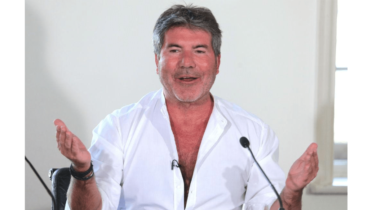 Simon Cowell balanced by charity work 8days