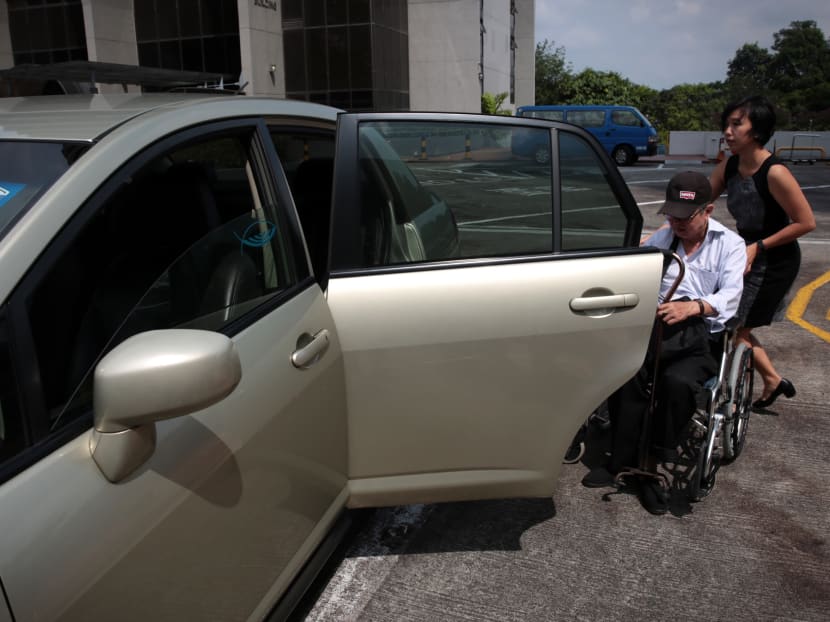 Beneficiary of Taxi Subsidy Scheme Lim Eng Whatt boards a private hire car on July 27, 2017. Photo: Jason Quah/TODAY