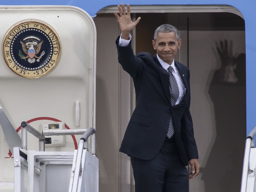 US President Barack Obama waves as he enters his plane "Air Force One" prior to his departure on November 18, 2016 at the Tegel airport in Berlin, where the US President met the German Chancellor and other European leaders. Photo: AFP
