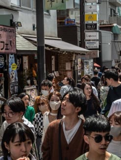 People walk through Komachidori shopping street in Kanagawa prefecture on May 3, 2023. 

