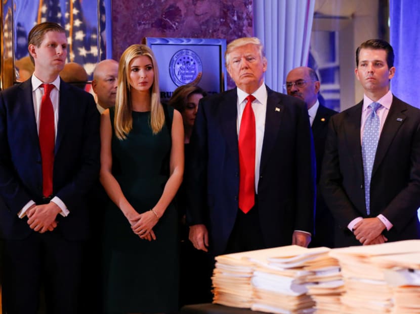 Mr Donald J Trump surrounded by his sons Eric Trump, left, and Donald Trump Jr, and daughter Ivanka Trump in Trump Tower in Manhattan on Jan 11. Photo: Reuters