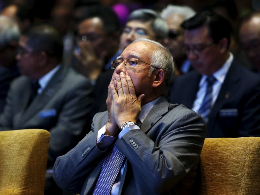 Malaysia's Prime Minister Najib Razak prays before he announces revisions to the fiscal budget in Putrajaya, Malaysia, January 28, 2016. Photo: Reuters