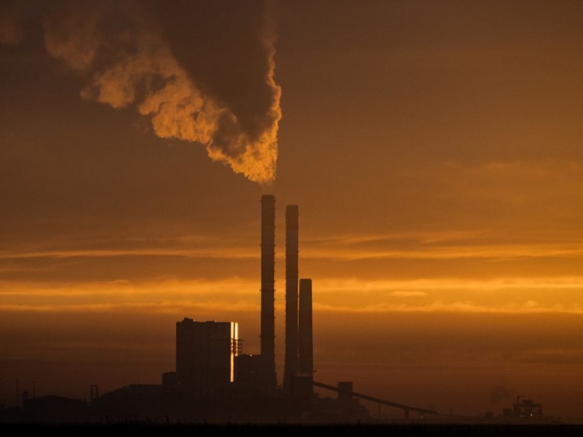 This picture taken in Cordemais Lavau-sur-Loire, western France on Jan 11, 2022 shows the sun rising over coal-fired powerplant of French multinational electric utility company EDF.