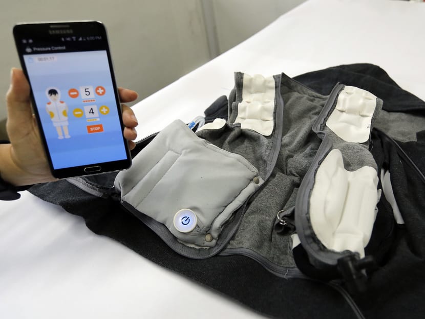 The mobile app and the inside of the T. Jacket showing the air bags which when inflated will  simulate deep touch pressure on the body using laterally applied air pressure. Photo: Ernest Chua/TODAY