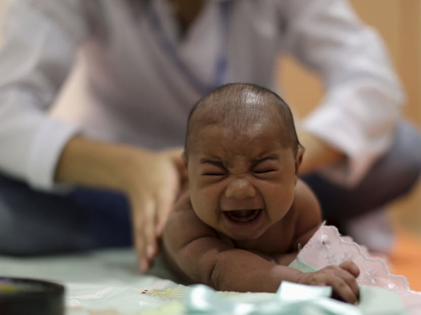 Pietro Rafael, who has microcephaly, reacts to stimulus during an evaluation session with a physiotherapist at the Altino Ventura rehabilitation center in Recife, Brazil, on Jan 28, 2016. Photo: Reuters