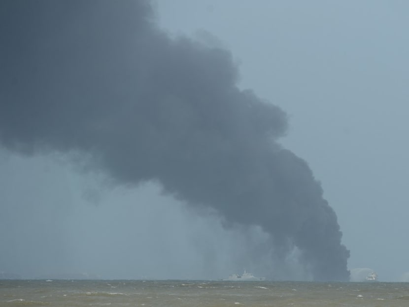 Thick smoke billows as fireboats work to extinguish a fire aboard the Singapore-registered container ship MV X-Press Pearl, which has been burning for the seventh consecutive day in the sea off Sri Lanka's Colombo Harbour, in Colombo on May 26, 2021.