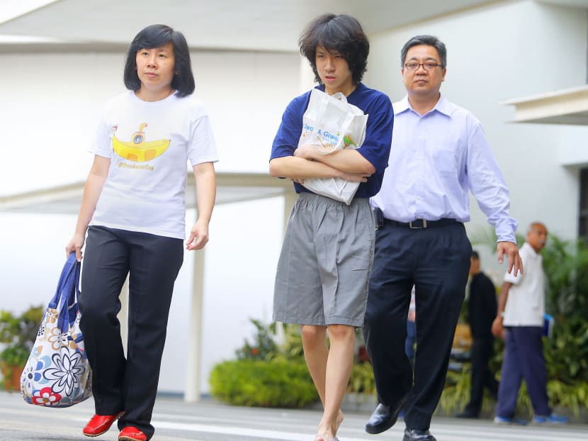 Amos Yee leaving the State Court with his parents after being sentenced. TODAY file photo
