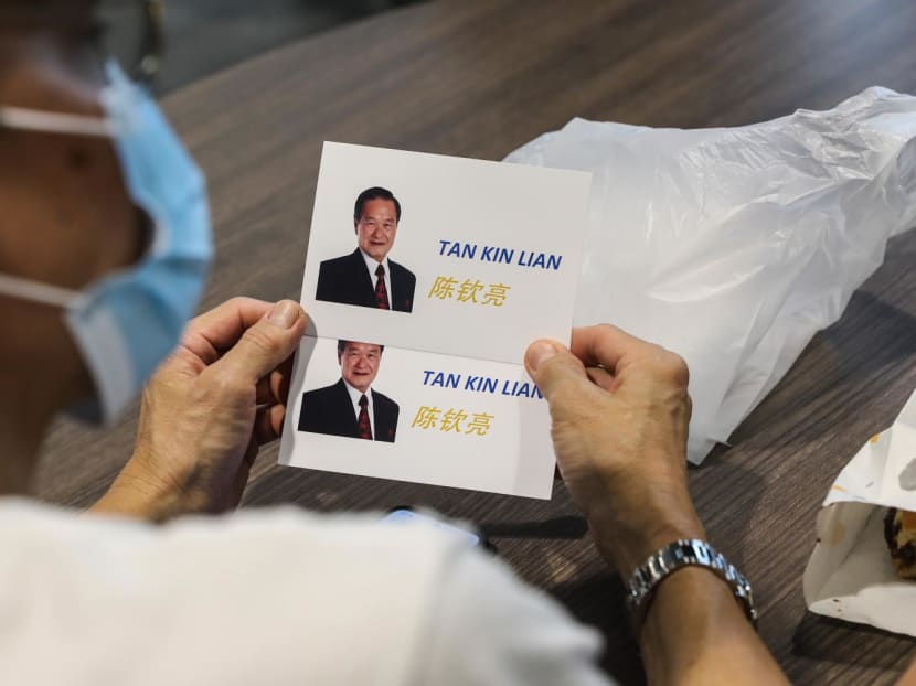 Campaign flyers for presidential candidate Tan Kin Lian being distributed during a walkabout at Senja Hawker Centre on Aug 24, 2023. 
