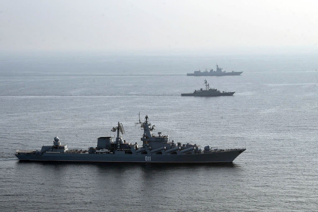 A handout picture made available by the Iranian Army official website on Jan 21, 2022 shows Iranian, Russia and Chinese warships during a joint military drill in the Indian ocean. 
