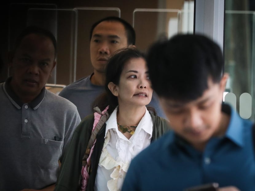 Lee Hui Yin (in white) at the State Courts on June 26, 2023. 