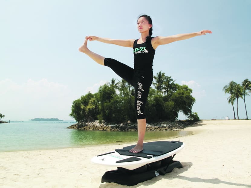 Gallery: New and niche fitness regimes are getting Singaporeans to surf, bounce and wield a light saber