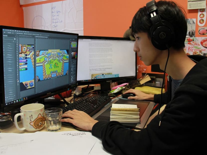 Shane Yap, 22, a junior game designer with Battle-Brew, working on a new mobile strategy game at PIXEL Studios. Photo: Esther Leong