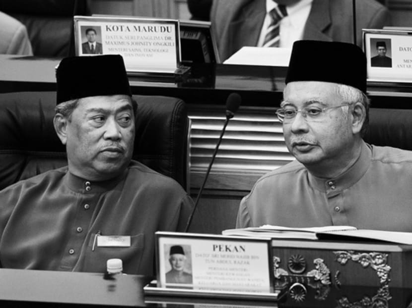 Mr Najib (right) with Mr Muhyiddin in parliament. Mr Muhyiddin is a popular leader in UMNO, but not nationally, while Mr Najib faces little global pressure to step down . Photo: Bloomberg