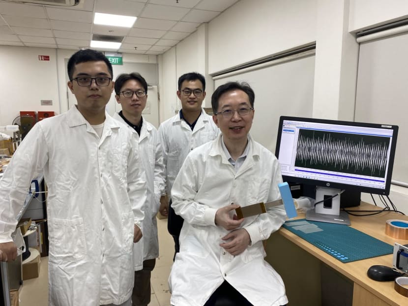 (L-R) The team from NTU’s School of Civil and Environmental Engineering: PhD student Liu Zicheng, research fellow Hu Guobiao, research associate Zhao Chaoyang and associate chair Professor Yang Yaowen, holding the wind harvester.