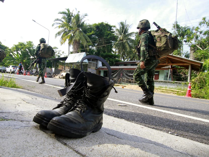 Photo of the day: Soldiers investigate a military checkpoint in Pattani, southern Thailand, on July 24, 2019 after an attack the previous night by insurgents left four dead.
