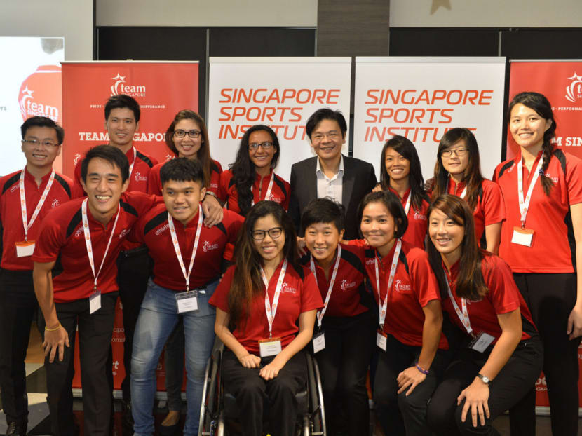 Minister Lawrence Wong with Team Singapore athletes. Photo: Sport Singapore