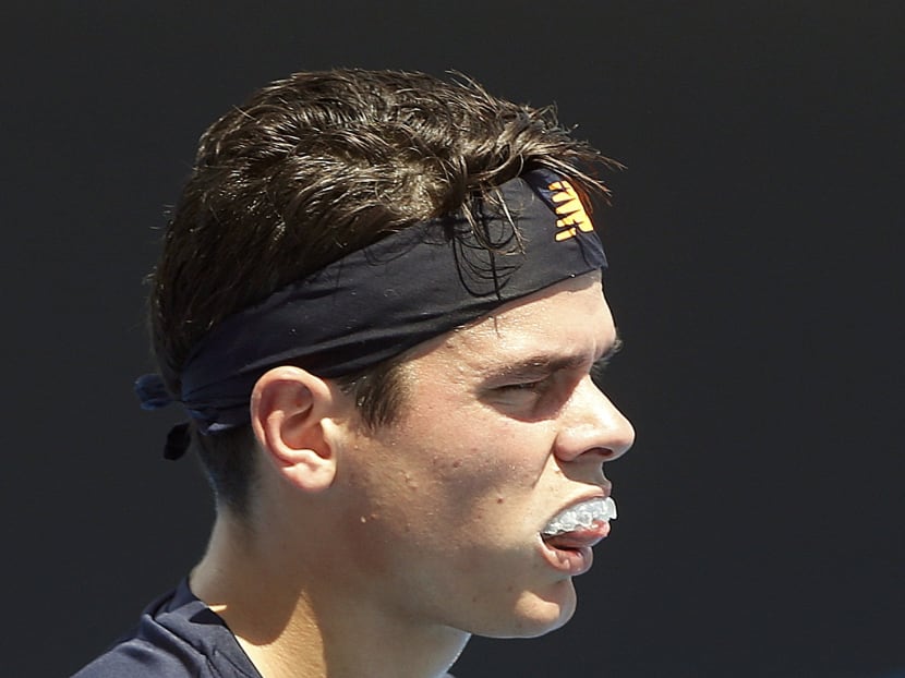 Teeth-grinding tennis player a mouthguard fan