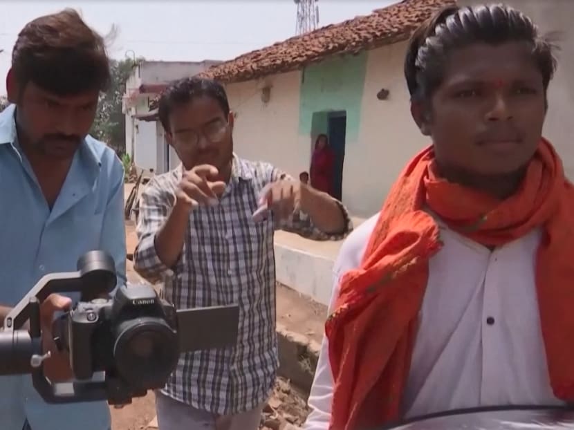 Indian Youtubers Gyanendra Shukla (left) and Jai Verma (centre) filming a video.