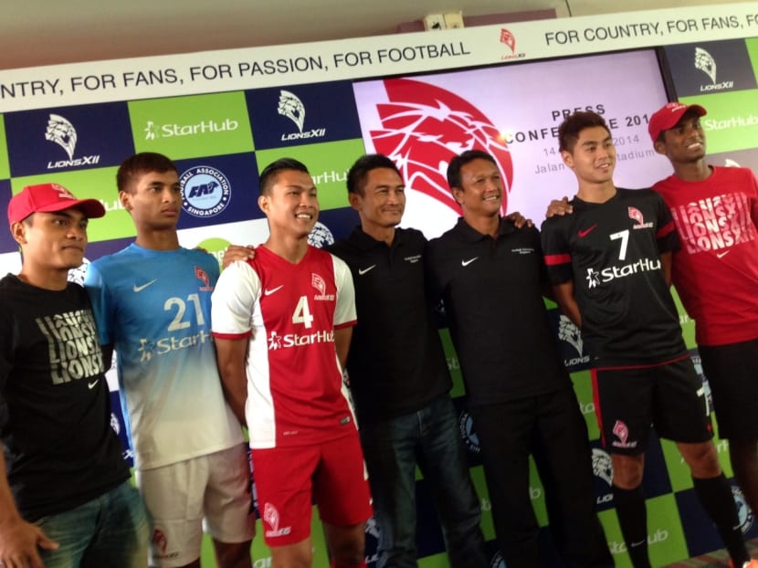 LionsXII head coach Fandi Ahmad and players showing up the side's new kit. Photo: SION TOUHIG