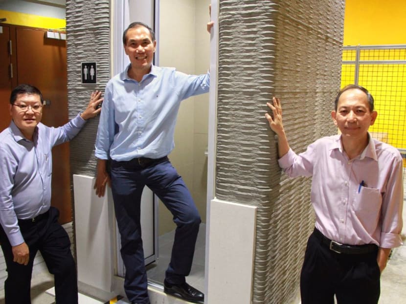 (L-R) Sembcorp team lead Er Lie Liong Tjen, NTU Singapore Centre for 3D Printing’s Dr Tan Ming Jen and Dr Wong Teck Neng with their first 3D-printed prefabricated bathroom unit.